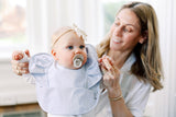 mom with baby girl wearing a sky blue ruffle angel waterproof baby bib